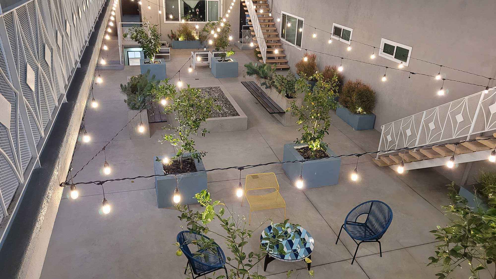 Bleu Apartments overhead courtyard string lights