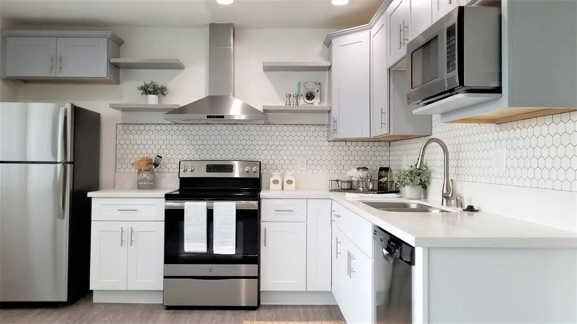 Bleu Apartments renovated kitchen hexagon tile backsplash