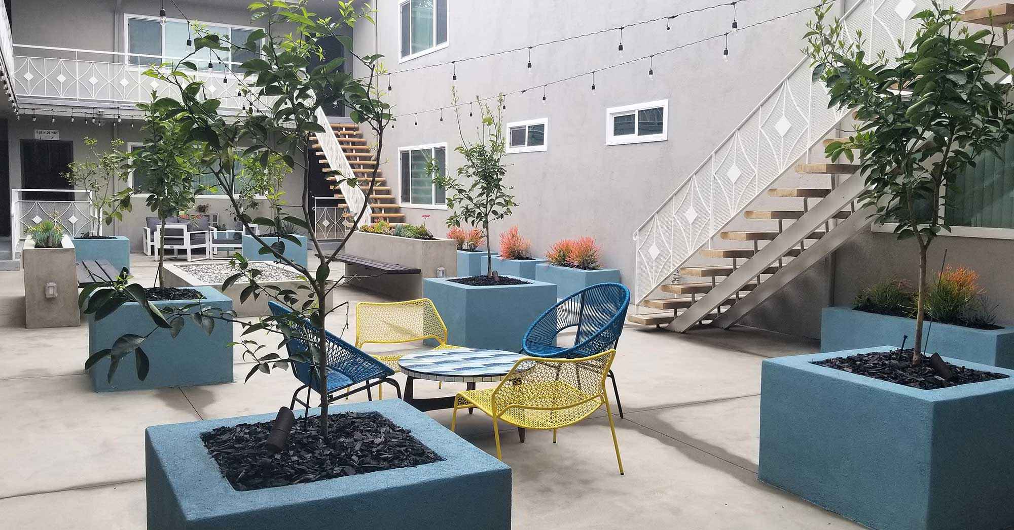 Bleu Apartments outdoor lounge with mid-century seating