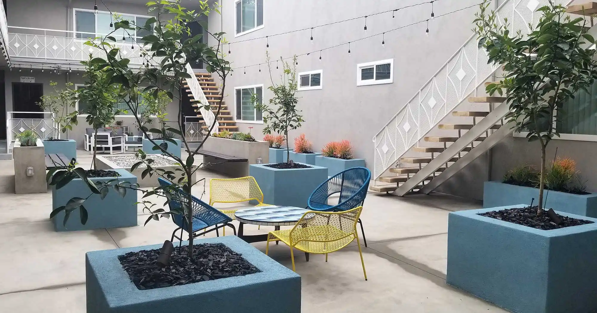 Bleu Apartments outdoor lounge mid century chairs seating