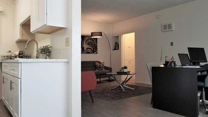 Kitchen and living room photo at Bleu Apartments