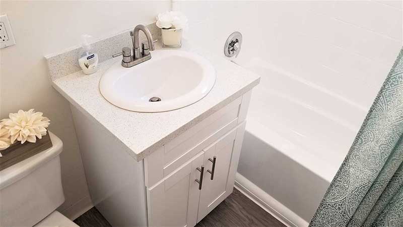 Bathroom sink interior photo of Bleu Apartments